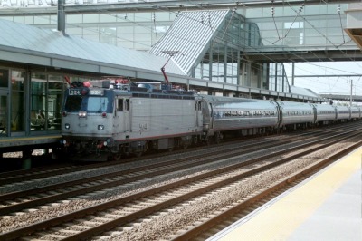 An Amtrak train, pulled by an AEM-7 electric locomotive, passes through the Newark Liberty International Airport trains station in Newark, N.J., in 2003.