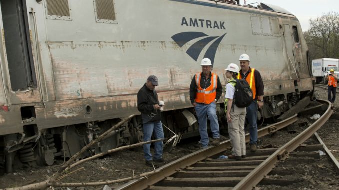 NTSB Recorder Specialist Cassandra Johnson works with officials on the scene of the Amtrak Train 188 Derailment in Philadelphia. (NTSB photo)