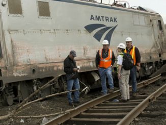 NTSB Recorder Specialist Cassandra Johnson works with officials on the scene of the Amtrak Train 188 Derailment in Philadelphia. (NTSB photo)